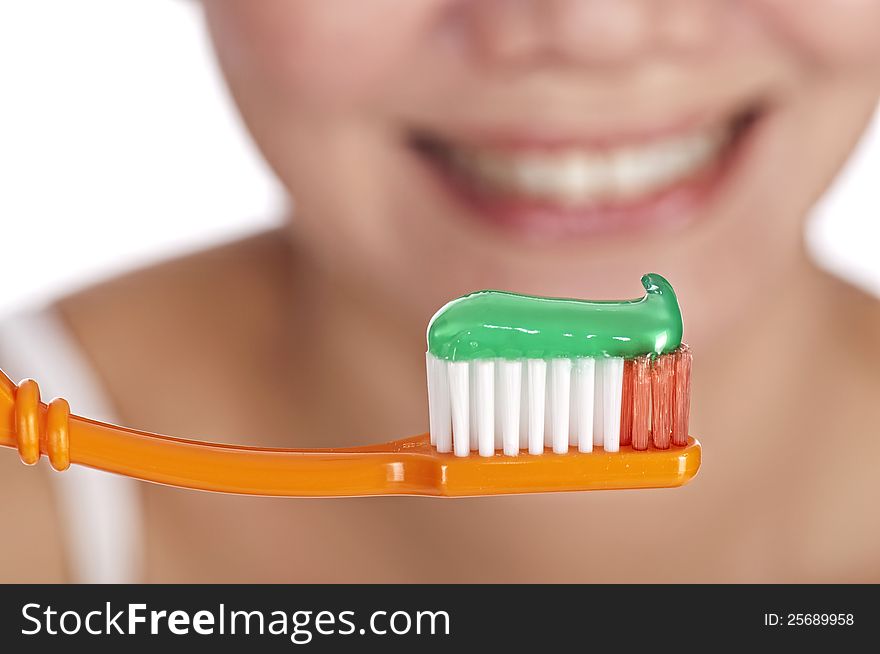 Smiling young woman with healthy teeth holding a tooth-brush. Smiling young woman with healthy teeth holding a tooth-brush