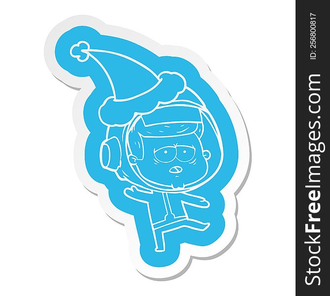 Cartoon  Sticker Of A Tired Astronaut Wearing Santa Hat