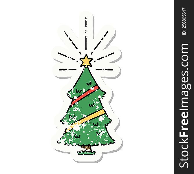 worn old sticker of a tattoo style christmas tree with star. worn old sticker of a tattoo style christmas tree with star