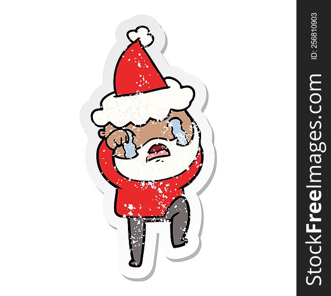 hand drawn distressed sticker cartoon of a bearded man crying and stamping foot wearing santa hat