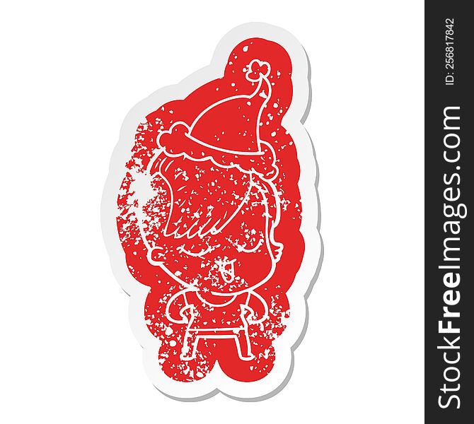 Happy Cartoon Distressed Sticker Of A Girl Wearing Santa Hat