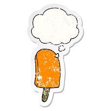 Cartoon Ice Lolly And Thought Bubble As A Distressed Worn Sticker Stock Photo