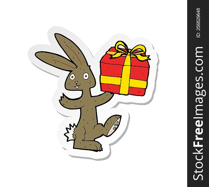 Sticker Of A Cartoon Rabbit With Christmas Present