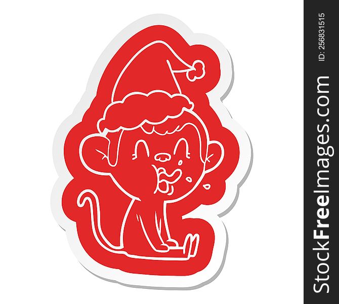 crazy quirky cartoon  sticker of a monkey sitting wearing santa hat