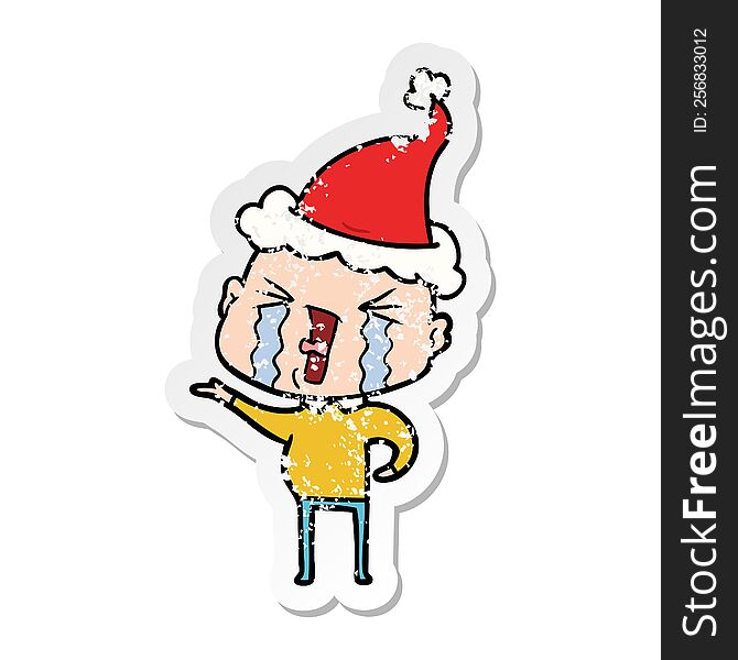 Distressed Sticker Cartoon Of A Crying Bald Man Wearing Santa Hat