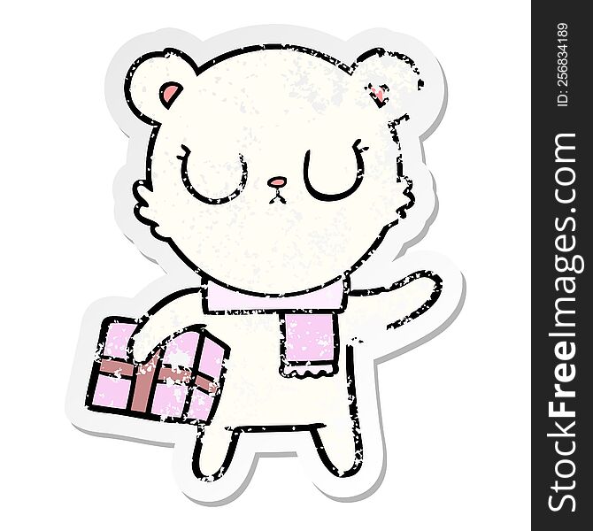 distressed sticker of a peaceful cartoon polar bear with christmas gift
