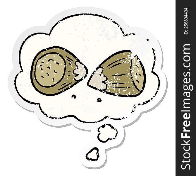 cartoon hazelnuts with thought bubble as a distressed worn sticker