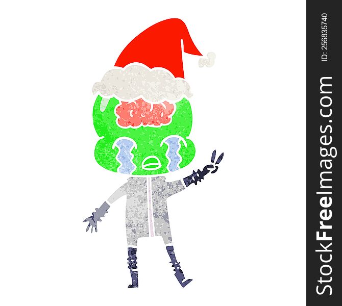 retro cartoon of a big brain alien crying and giving peace sign wearing santa hat