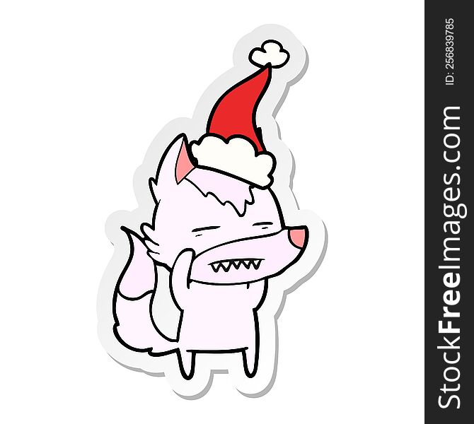hand drawn sticker cartoon of a wolf showing teeth wearing santa hat