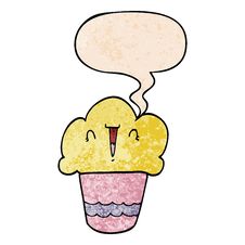 Cartoon Cupcake And Face And Speech Bubble In Retro Texture Style Stock Photo