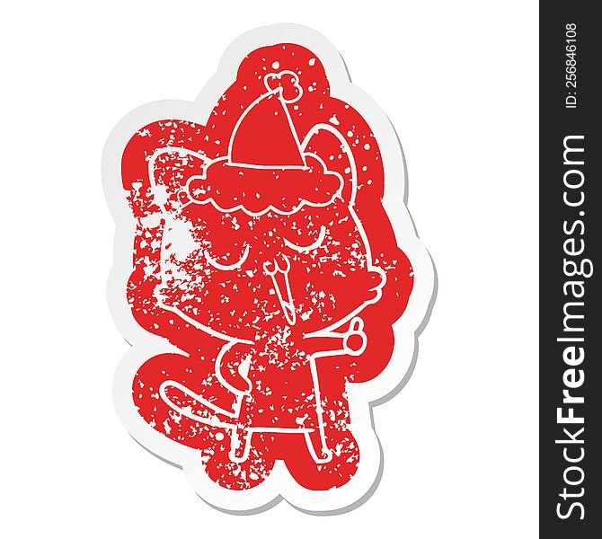 Cartoon Distressed Sticker Of A Cat Singing Wearing Santa Hat