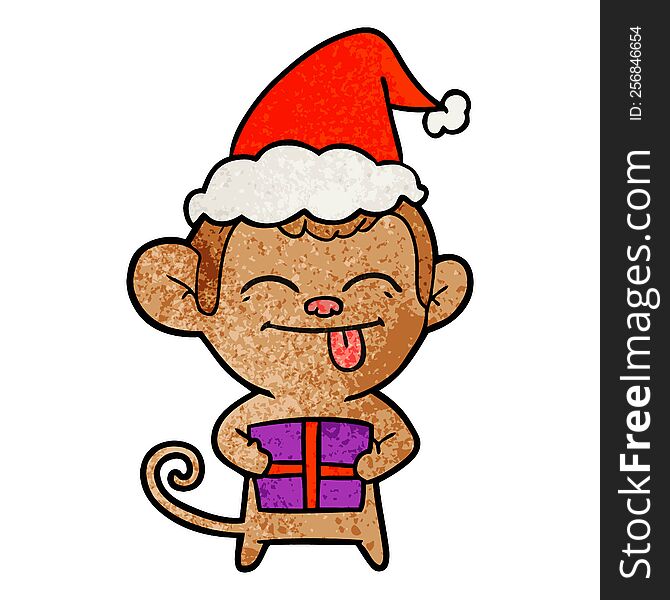 funny hand drawn textured cartoon of a monkey with christmas present wearing santa hat
