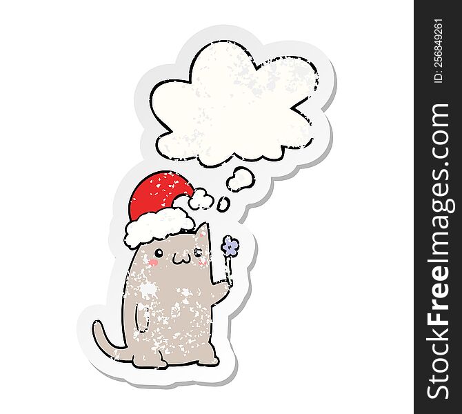cute cartoon christmas cat with thought bubble as a distressed worn sticker