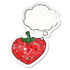 Cartoon Strawberry And Thought Bubble As A Distressed Worn Sticker Stock Photo