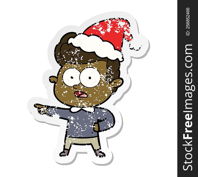Distressed Sticker Cartoon Of A Staring Man Wearing Santa Hat