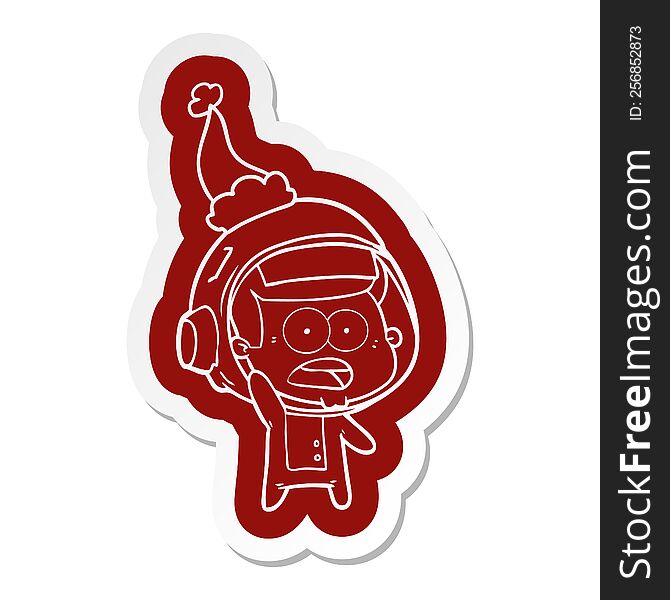 Cartoon  Sticker Of A Surprised Astronaut Wearing Santa Hat
