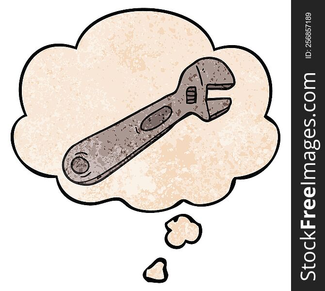 cartoon spanner and thought bubble in grunge texture pattern style