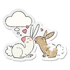 Cartoon Rabbits In Love And Thought Bubble As A Distressed Worn Sticker Stock Image