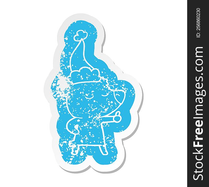 happy quirky cartoon distressed sticker of a bear giving thumbs up wearing santa hat