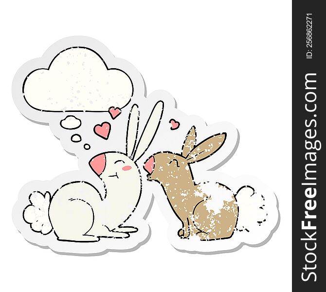 cartoon rabbits in love with thought bubble as a distressed worn sticker