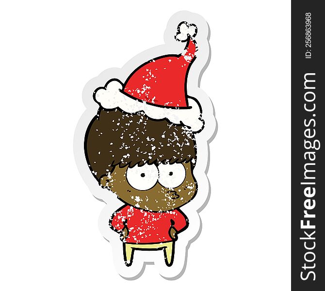 Nervous Distressed Sticker Cartoon Of A Boy Wearing Santa Hat
