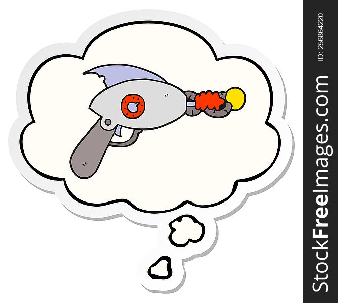 cartoon ray gun with thought bubble as a printed sticker