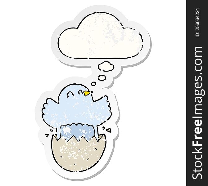 cartoon hatching chicken with thought bubble as a distressed worn sticker
