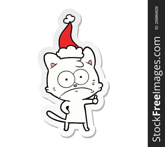 hand drawn sticker cartoon of a nervous cat wearing santa hat