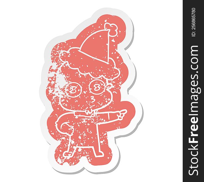 Cartoon Distressed Sticker Of A Weird Bald Spaceman Wearing Santa Hat