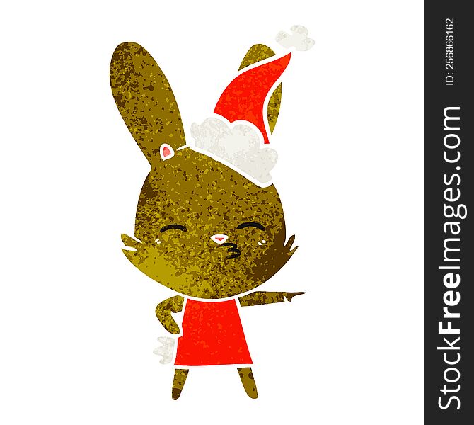 curious bunny hand drawn retro cartoon of a wearing santa hat. curious bunny hand drawn retro cartoon of a wearing santa hat