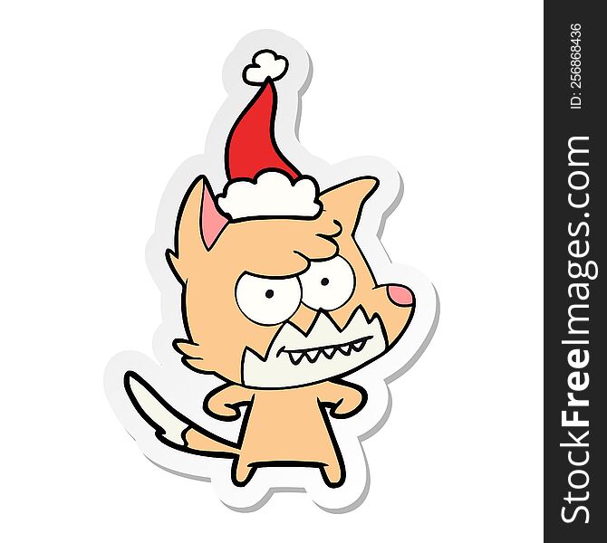 hand drawn sticker cartoon of a grinning fox wearing santa hat