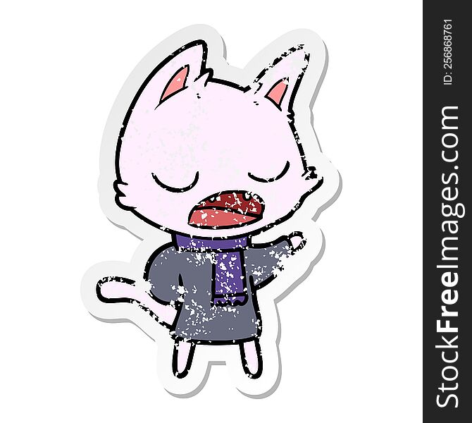 distressed sticker of a talking cat wearing winter clothes