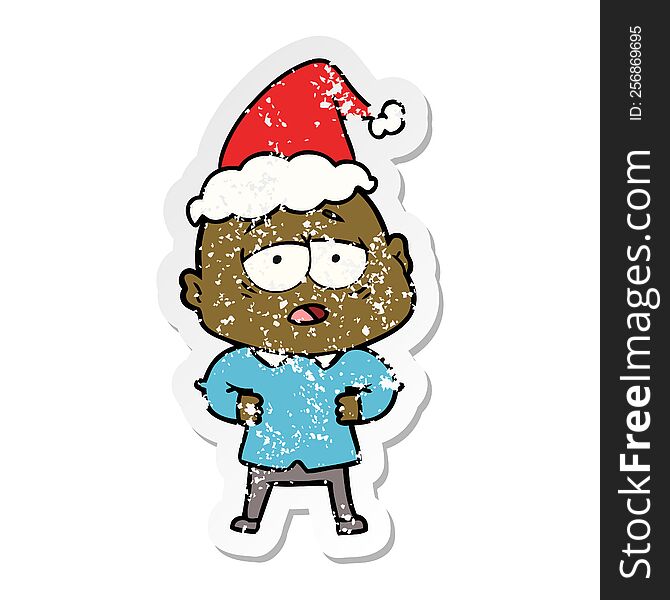 Distressed Sticker Cartoon Of A Tired Bald Man Wearing Santa Hat