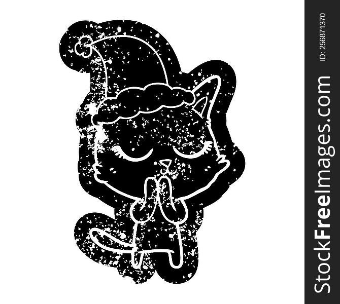 calm quirky cartoon distressed icon of a cat wearing santa hat