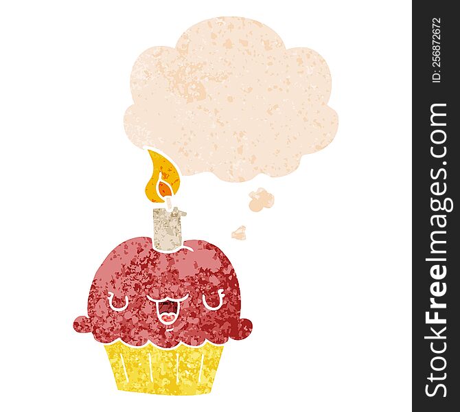 cartoon cupcake with thought bubble in grunge distressed retro textured style. cartoon cupcake with thought bubble in grunge distressed retro textured style
