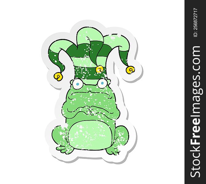 retro distressed sticker of a cartoon nervous frog wearing jester hat