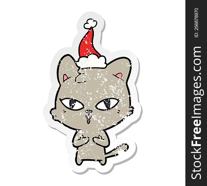 distressed sticker cartoon of a cat wearing santa hat