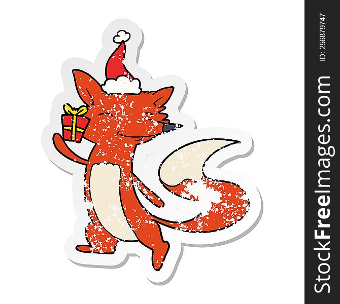 Distressed Sticker Cartoon Of A Happy Fox Wearing Santa Hat
