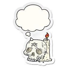 Cartoon Spooky Skull And Candle And Thought Bubble As A Printed Sticker Royalty Free Stock Photography