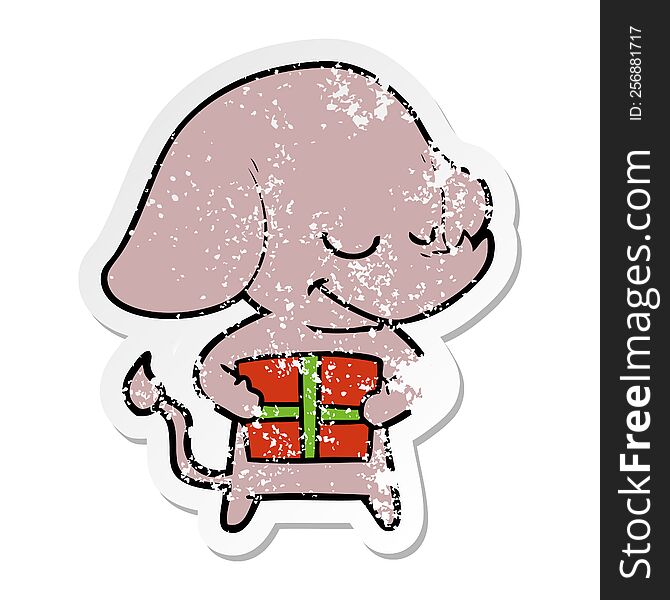 Distressed Sticker Of A Cartoon Smiling Elephant With Present