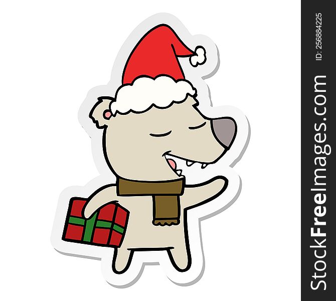 Sticker Cartoon Of A Bear With Present Wearing Santa Hat