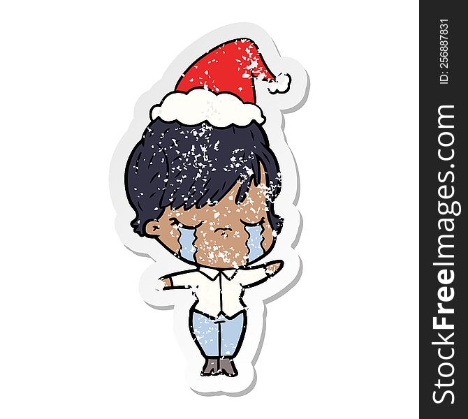 hand drawn distressed sticker cartoon of a woman crying wearing santa hat