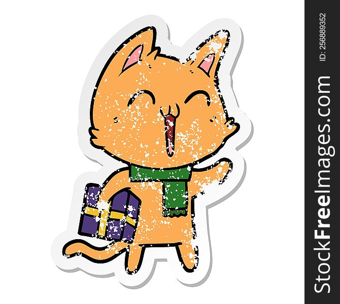 distressed sticker of a happy cartoon cat with christmas gift