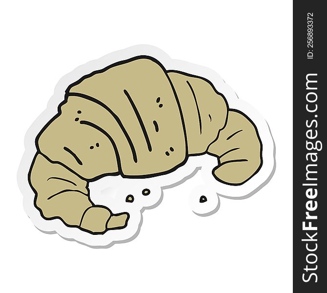 sticker of a cartoon croissant