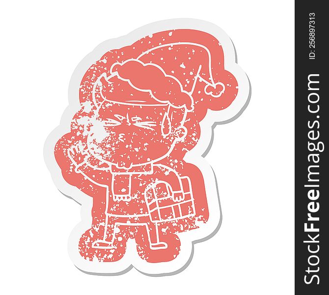 quirky cartoon distressed sticker of a man sweating wearing santa hat
