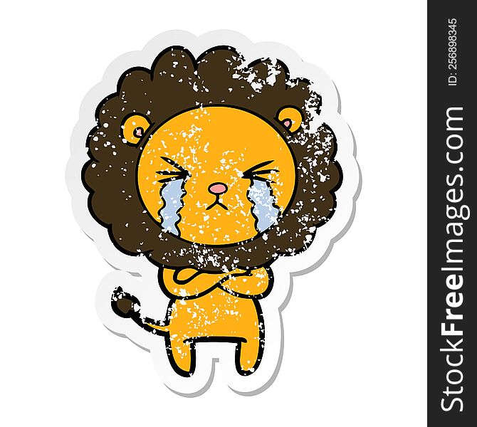 Distressed Sticker Of A Cartoon Crying Lion With Crossed Arms