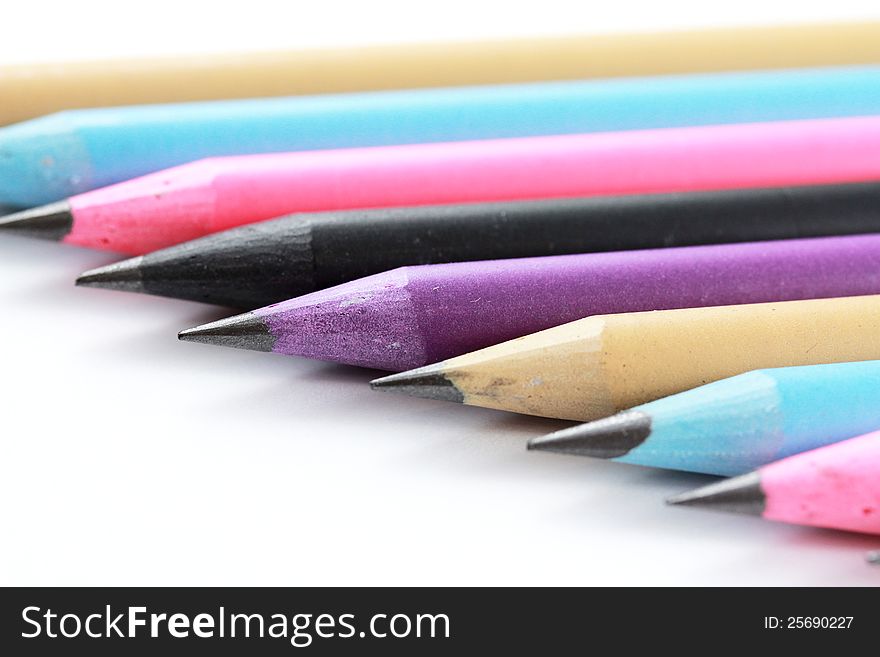 Bright Coloured Pencils Against White Background