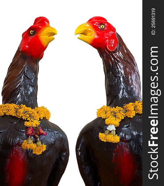 Isolates of the statue, which has two black chickens garland of flowers that are withered neck. Isolates of the statue, which has two black chickens garland of flowers that are withered neck.