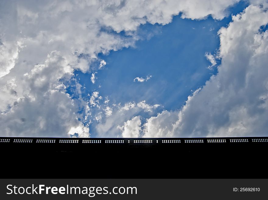 Cloudy blue sky view. Horizontal shot.