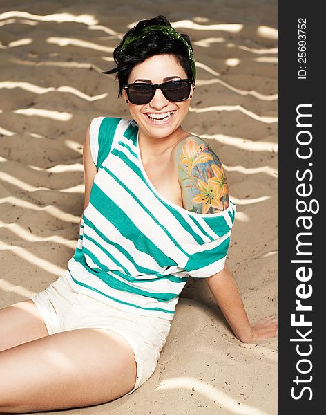 Adorable Girl With Tattoo Wearing Sunglasses